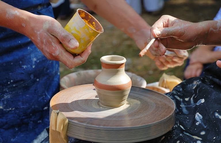Image of hands molding with clay